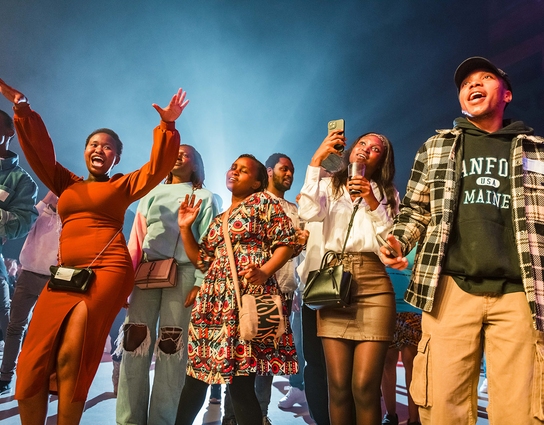 A diverse group of students dancing together